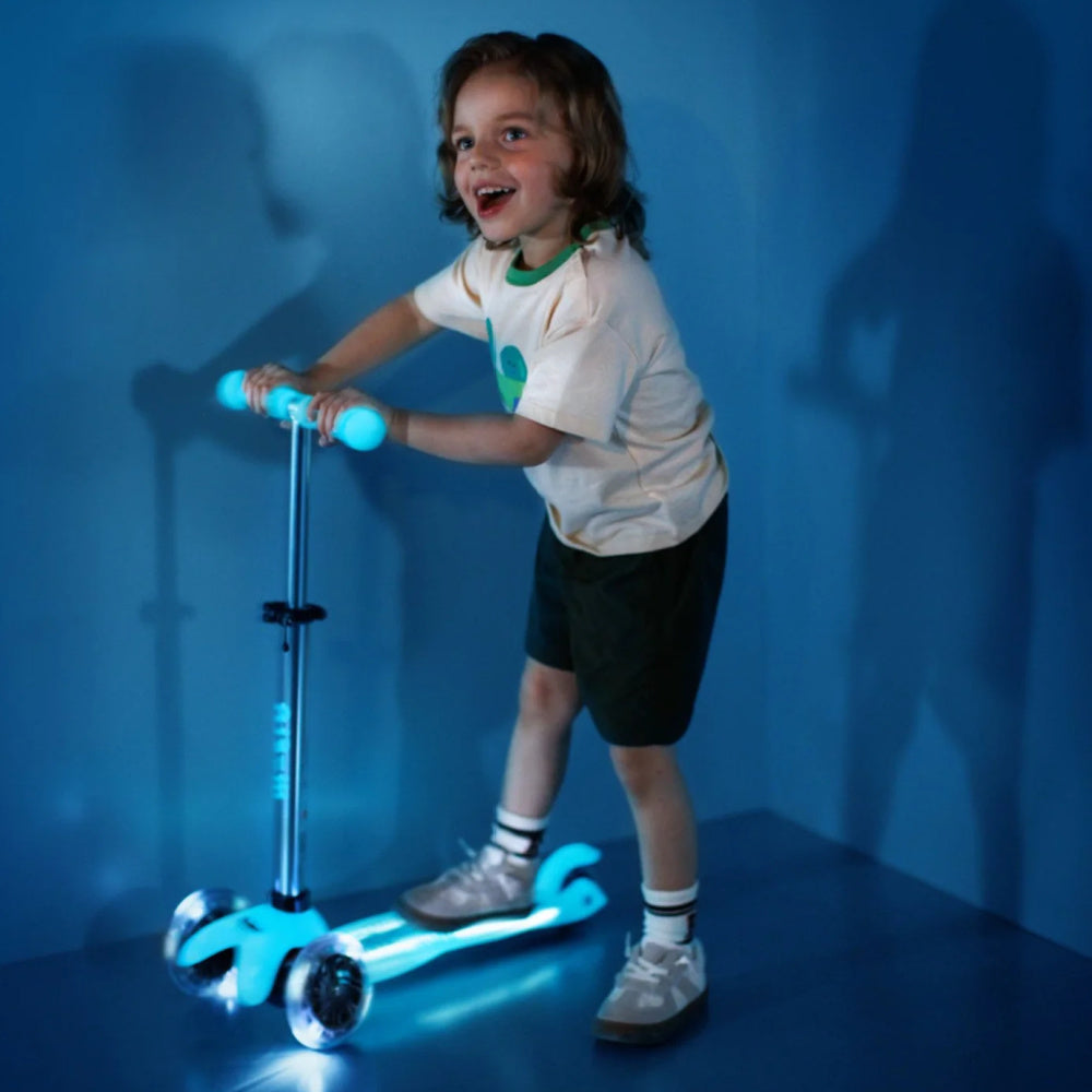 Micro-Mini-Deluxe-Glow-PLUS-3-Wheel-Scooter-Blue-Lit-In-Use